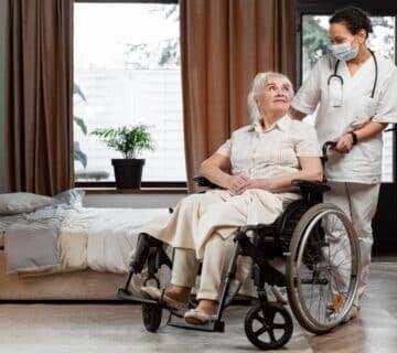 Doctor talking with her elder patient 360x320
